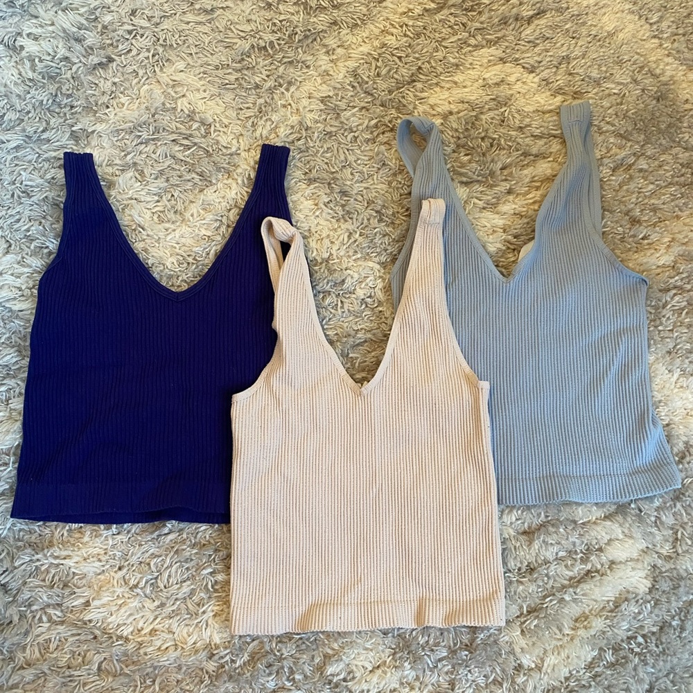Baby pink, baby blue, and navy blue blue tank tops - size: small
